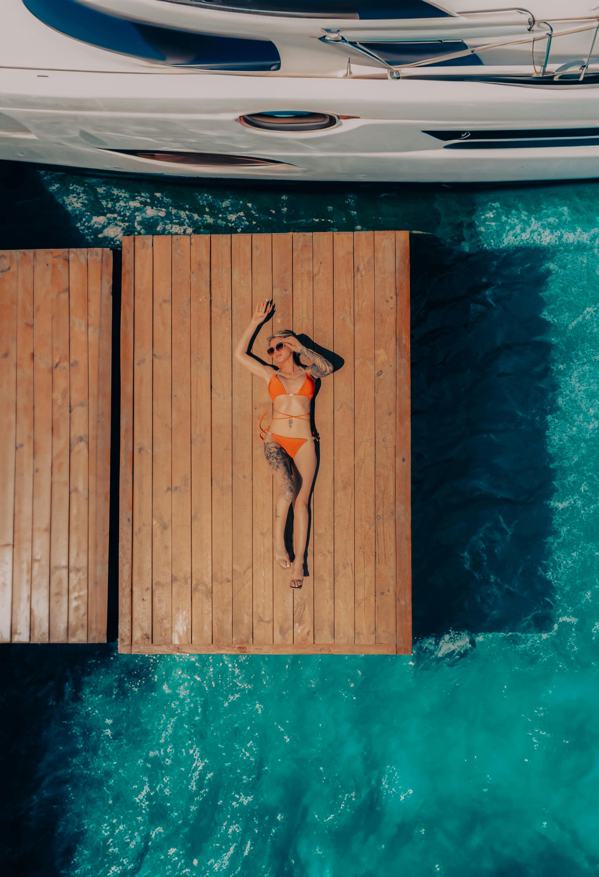 Teak decking on a yacht weathered by South Florida salt and sun exposure